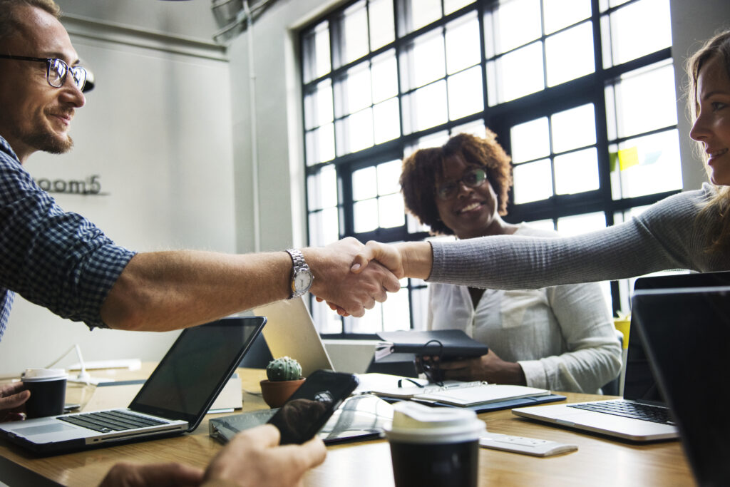 business people shaking hands in agreement